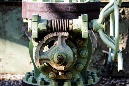 An old valve on a pipeline. The bolted flange shows no leeks.