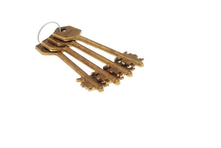 Bunch of old rusty bronze keys on white background 4