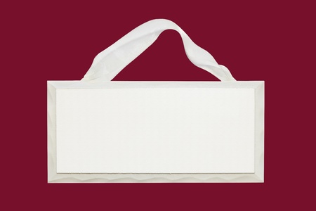 blank white wooden sign with ribbonの写真素材