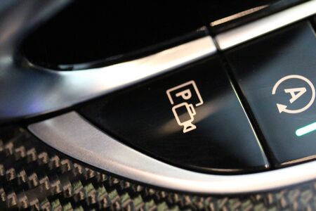 Parking camera button in luxury vehicle