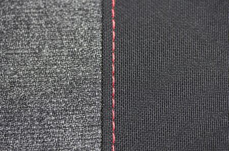 Two fabrics with red stitching