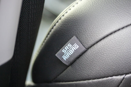 Closeup of an airbag label on the seat of a new luxury vehicleの写真素材