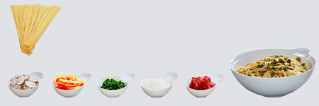 Pasta dish incl. All individual ingredients. Spaghetti, onion, paprika, ham, herbs. Italian food.の写真素材