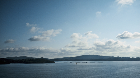 Entrance of the harbor of Bergen on a cold early summer morningの写真素材