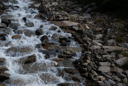Waterfall in mountains in Alps