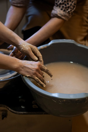 Potter making pottery in a pottery workshop, close upの写真素材