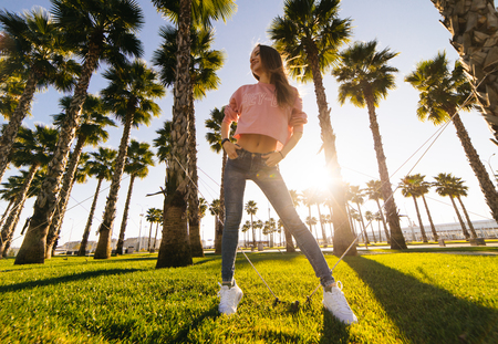 fashion young beautiful woman on a background of palm treesの写真素材