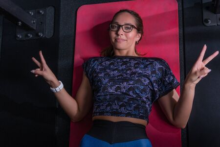 At the fitness club, the trainer is training