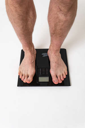 Man with weights health pondered, health and sports on a white background pain body muscle, ill sick man health adult, illness Tension neck therapy, lower suffer attractiveの写真素材