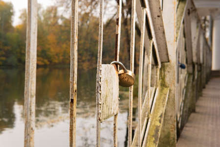 Wedding tradition background bridge travel, fence security happiness hanging white, close. Durable married steel chainの写真素材