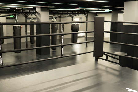 RUSSIA, MOSCOW - FEB 24, 2022: bag punching boxing background exercise, for competition sport for punch for hobby impact, kickboxing target. Martial circle dark,のeditorial素材