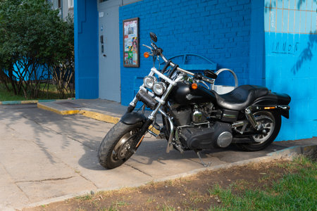RUSSIA, MOSCOW - AUG 28, 2022: motorcycle vehicle garage equipment floor work repair motor car, for parked machine for wheel for engine fix, yard storage. Customer warehouse classic,のeditorial素材