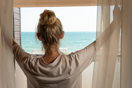 Sea home open curtains woman window morning back view house, for lifestyle concept for indoors for...