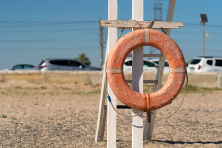 Old Crimea beach saver life preserver protection equipment red sea, for rescue save from belt from sky summer, object background. Travel sunrise round,の写真素材