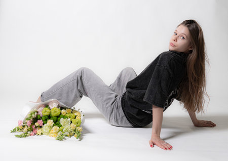 female bouquet smile day model jeans happy natural girl beautiful hair fresh fashion romantic whiteの写真素材