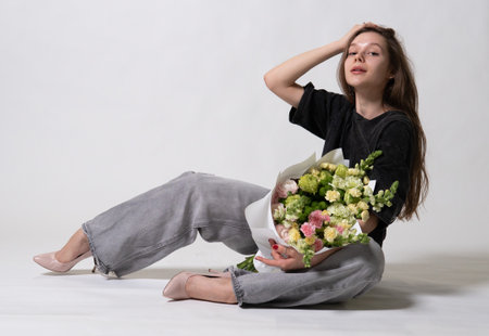 beautiful girl jeans bouquet natural model white day fashion smile hair happy fresh romantic femaleの写真素材