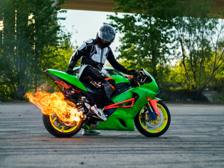 Motorcyclist flame from the mufflerの写真素材