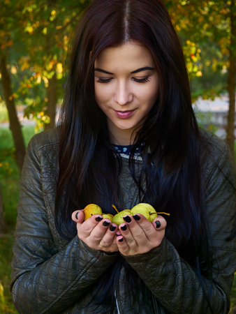 Girl with apples (pears)の写真素材