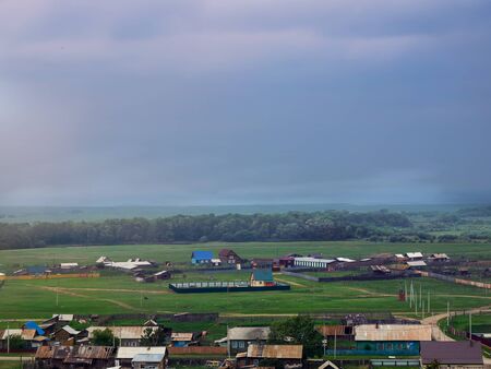 Village view from high against the skyの写真素材