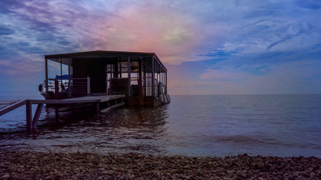 Colorful photo of the sea pier at sunsetの写真素材