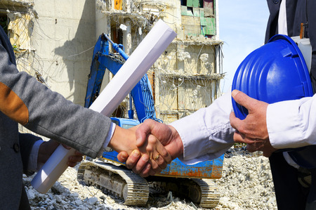 Handshake in construction site