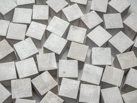 White wooden blocks on a white background. Close-up, selective focus.の写真素材