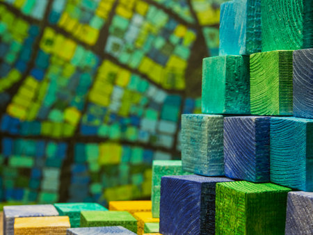 Colorful wooden blocks on the background of a map of the worldの写真素材