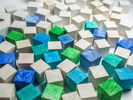 Colorful wooden building blocks on a white background. Close up.の写真素材