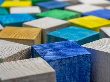 Colorful wooden blocks as a background. Close-up image.