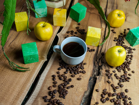 Coffee cup and coffee beans on wooden background. Coffee break conceptの写真素材