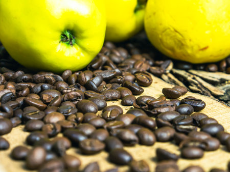 Coffee beans and apple on the table. Selective focus.の写真素材