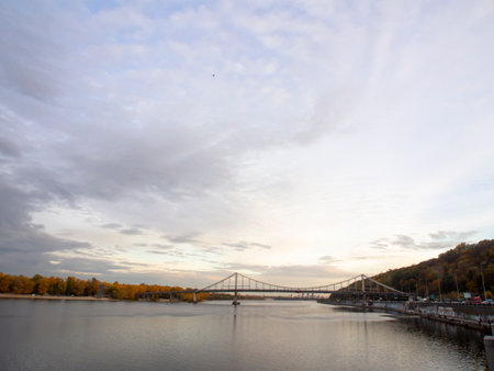 Autumn landscape with bridge over the Dnieper river in Kiev, Ukraine. View of the Dnipro River and...