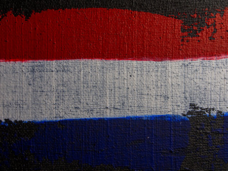 flag of netherlands painted on grunge wall, abstract backgroundの写真素材