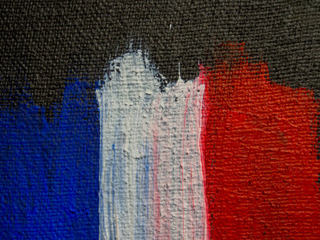 French flag painted on a wall with brushstrokes in blue and redの写真素材
