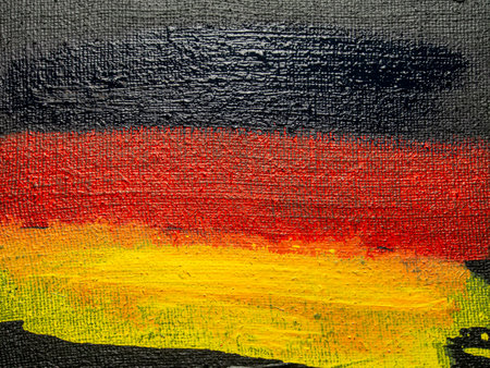 Flag of Germany painted on canvas. Grunge background and texture.の写真素材