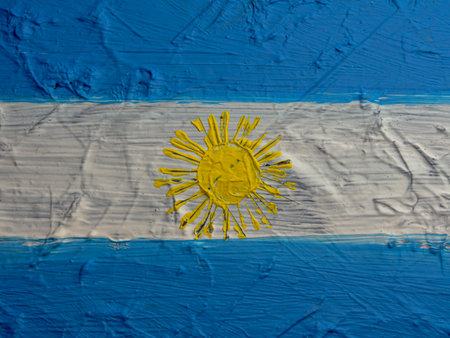 National flag of the Republic of Argentina painted on a wall with blue paintの写真素材