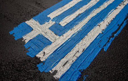 Greece flag painted on asphalt road. Country national flag background.の写真素材