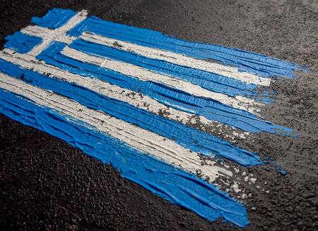 The national flag of Greece painted on the asphalt. The concept of national pride and symbol of the country.の写真素材