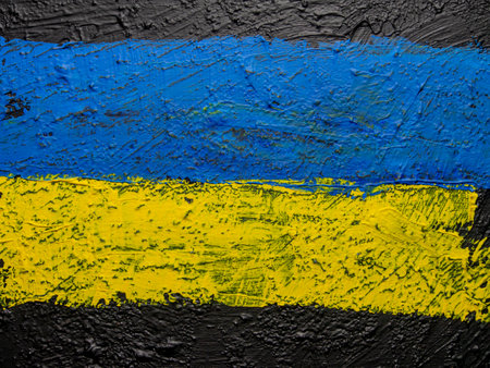 Ukrainian flag painted on a concrete wall. Selective focus.の写真素材