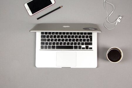 Office workplace table with supplies, smartphone and laptop. Flat lay. Top view with space for your textのeditorial素材