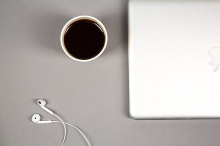 Office workplace table with supplies, smartphone and laptop. Flat lay. Top view with space for your textのeditorial素材