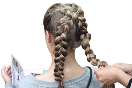 Hairdresser making a braid for a girl  Children s hairstyle  Braids 