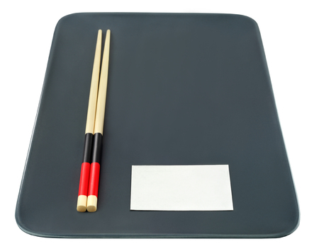 Empty plate with chinese sticks and business card with free space isolated on white.の写真素材