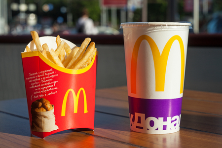Minsk, Belarus, june 6, 2017: french fries and soft drink on table at McDonald's restaurantのeditorial素材