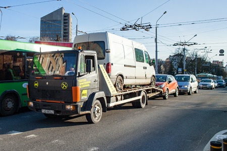 Minsk, Belarus, April 4, 2018: Tow truck is transporting a faulty minibus.