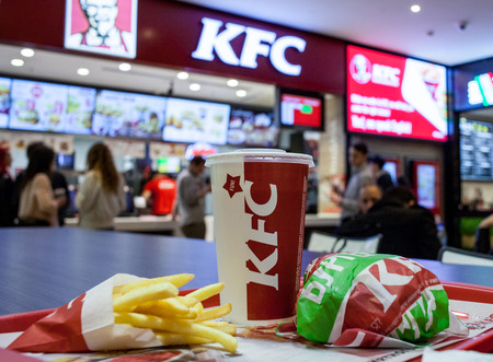 Minsk, Belarus, April 17, 2018: Lunch from chicken hamburger, french fries and drink at KFC...