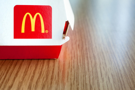 Minsk, Belarus - august 12, 2018: Big Mac Box with McDonald's logo on table in McDonald's Restaurant