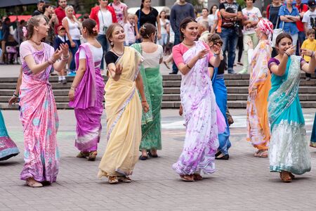 Minsk, Belarus - august 16, 2014: Disciples of Hare Krishna movement dancing and chanting prayers  on city street.のeditorial素材