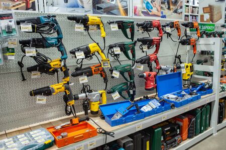 Minsk, Belarus, April 17, 2019: Great choice of construction electric tools of various manufacturers in a store for construction.のeditorial素材