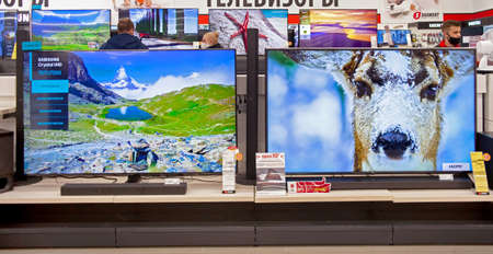 Televisions of different brands in the electronics store. Minsk, Belarus - March 2021